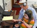Grandpa Charlie, K4LF, coaches Hope to her first FD contact.